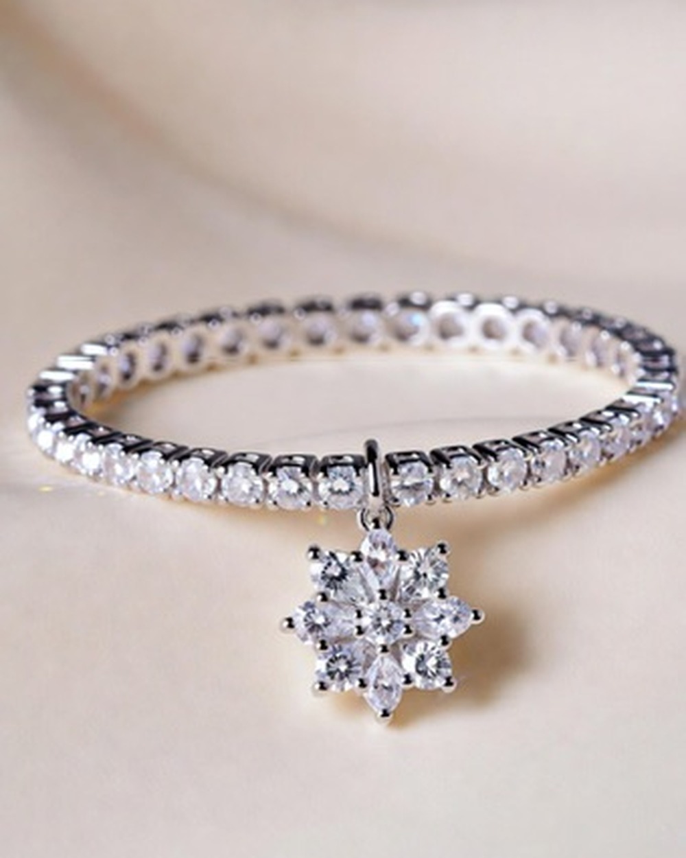 Fiore Tennis Bracelet — moissanite sterling silver bracelet, studio photograph on a clean background